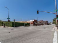 empty street near a traffic light at a red light in the middle of a street