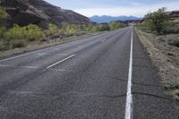 USA Utah: Deserted Road in Red Rock Landscape