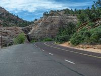 USA's Utah: A Road amidst Mountains and Clouds