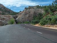 USA's Utah: A Road amidst Mountains and Clouds