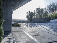 the exterior and landscape of a modern house in los angeles, california with stone and wood