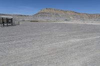 a red truck is driving through the rocky landscape of the desert of an arid area