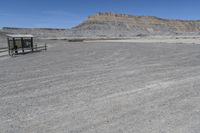 a red truck is driving through the rocky landscape of the desert of an arid area