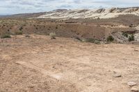 man standing in the desert next to a stop sign that reads, the trail is marked with a red light