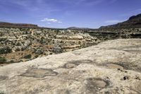 a vast expanse in the desert with the sky above and trees on the ground below