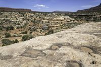 a vast expanse in the desert with the sky above and trees on the ground below