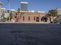 city buildings, street lights, and a fire hydrant on a sunny day in the middle of a city