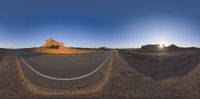 the view of a street with a mountain in the background as seen through the lens of a fisheye