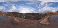 the large boulders have many different formations around them and many blue sky is in this 360 - view