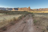 Utah Dawn: Road Through the Desert Sand Landscape