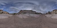 360 - view image of the desert landscape as it is surrounded by large rocks and mountains