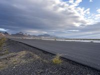 Utah Desert Dawn: Endless Road and Mountain Range