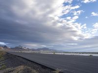 Utah Desert Dawn: Endless Road and Mountain Range