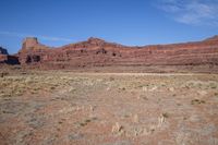 Utah Desert Landscape with Brown Bedrock and Vegetation