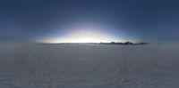 the sun is shining down over a desert landscape as if the snow is still flat