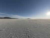 a view of a deserted vast and barren area that appears to be deserted from the perspective of the vehicle