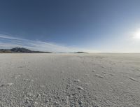 a view of a deserted vast and barren area that appears to be deserted from the perspective of the vehicle