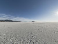 a view of a deserted vast and barren area that appears to be deserted from the perspective of the vehicle