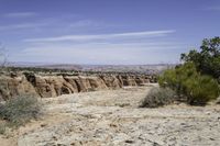 a scenic landscape of mountains, trees and rocks in arizona's southern desert with a sky background