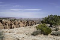 a scenic landscape of mountains, trees and rocks in arizona's southern desert with a sky background