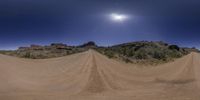 this is a wide angle of a road with dirt trails in the center of it