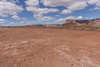 the landscape is empty and brown, with no one else on it as well as the sky