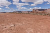 the landscape is empty and brown, with no one else on it as well as the sky