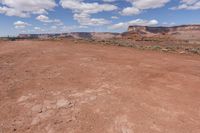 the landscape is empty and brown, with no one else on it as well as the sky