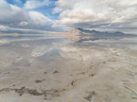 Utah Desert: Salt Lake and Mountain Range with Visible Sun