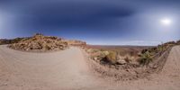 a dirt road is shown through two images, which are 360 - angleed together