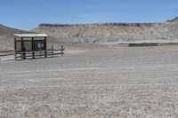 a red truck is driving through the rocky landscape of the desert of an arid area