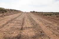 Utah Gravel Road: Desert Vegetation and Rugged Terrain