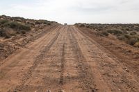 Utah Gravel Road: Desert Vegetation and Rugged Terrain