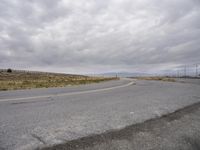 an empty road with no cars, no traffic, and no driving sign on it