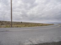 an empty road with no cars, no traffic, and no driving sign on it