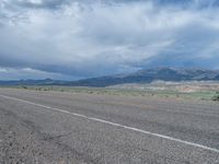 Utah Landscape: Asphalt Road with Majestic Mountains