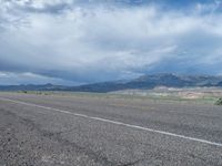 Utah Landscape: Asphalt Road with Majestic Mountains