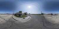 a three way street view shows the intersection and cars driving on the side of the road