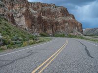 Utah Landscape: Clouds and Mountains Surrounding the Road