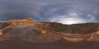 a 360 - up photo of the sky and surrounding mountains in a desert like setting