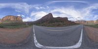 a fisheye lens captures a desert setting and street scene from the outside looking out