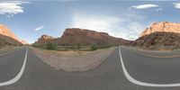 a fisheye lens captures a desert setting and street scene from the outside looking out