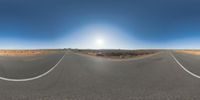 a fisheye lens captures a desert setting and street scene from the outside looking out