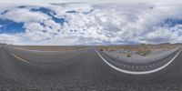 the three lane highway is seen in this panoramic photograph as seen through google street view glasses