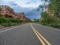 Utah Landscape: A Picturesque Road with Asphalt Under a Clear Sky