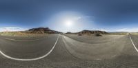 two circular images of a road in the desert, showing the sun on the horizon