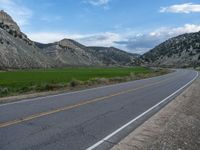 Utah Landscape: Road, Clouds, and Majestic Mountains