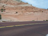 Utah Landscape: A Road Amongst Majestic Mountains and Clouds