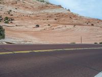 Utah Landscape: A Road Amongst Majestic Mountains and Clouds