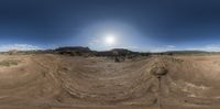 a 360 - angle view of a desert area in the daytime, with a half - way turn showing off on one end and two ends